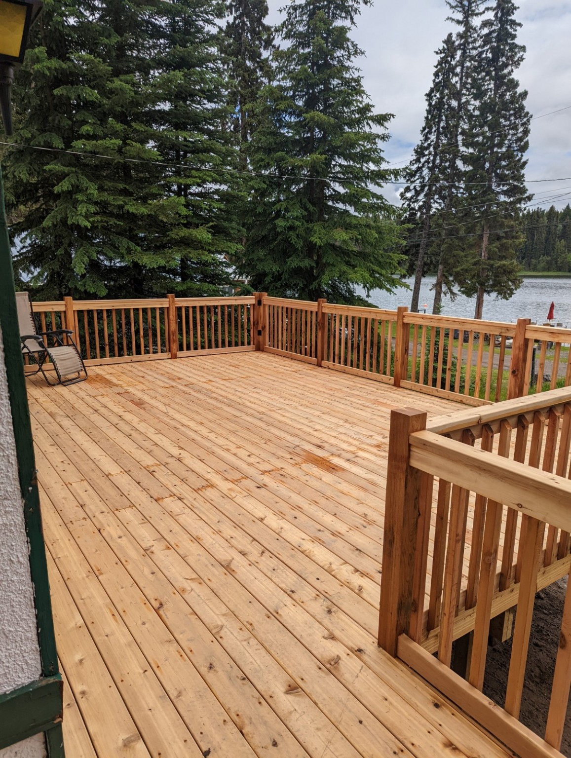 Cedar deck and railings with a view of the lake