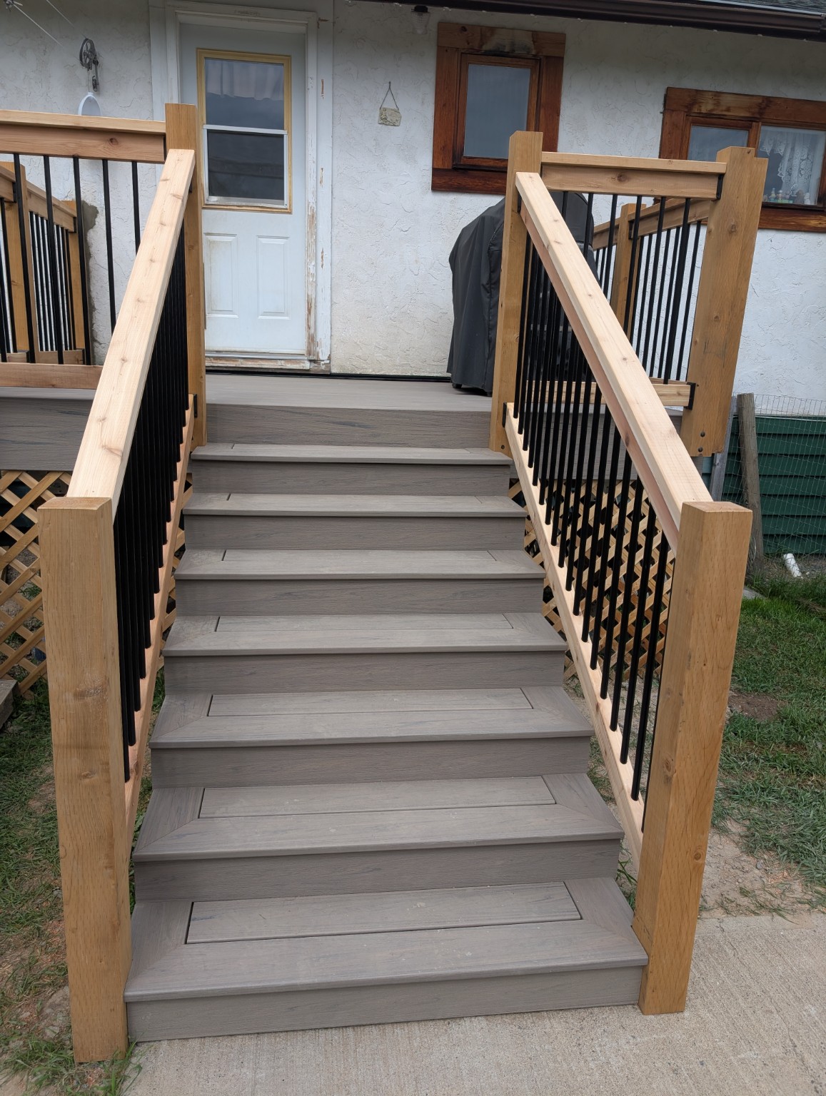 Trex deck surface and railings alongside the house